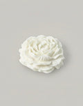 White peony candle  on a gray background